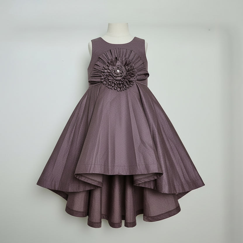 Purple dress on a mannequin against a white background