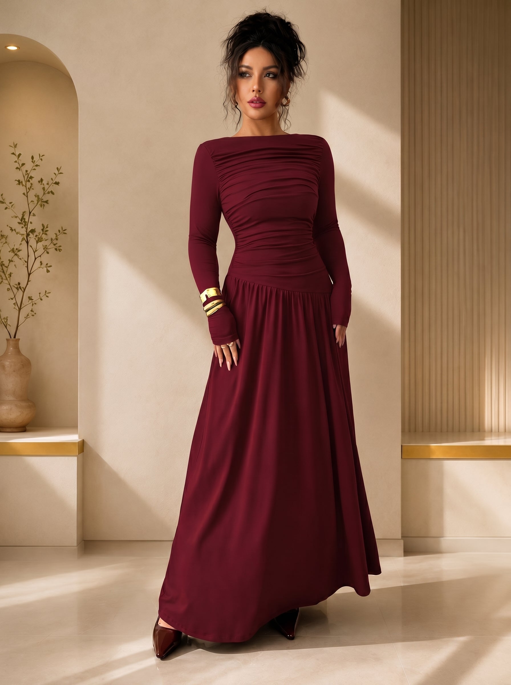 Woman wearing a burgundy evening gown in an elegant indoor setting