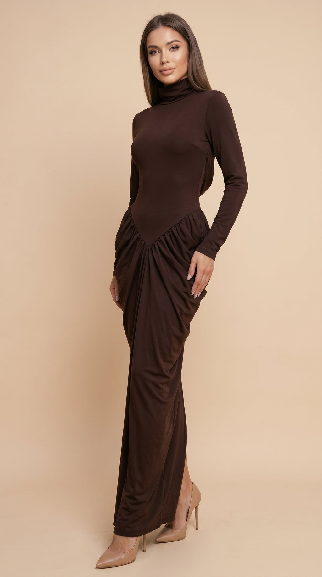 Woman wearing a brown long-sleeve dress against a beige background