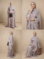 Woman modeling a floral abaya in multiple poses against a beige background